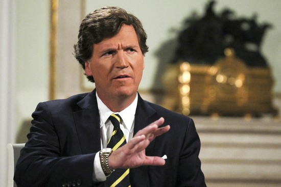 In this photo released by Sputnik news agency on Friday, Feb. 9, 2024, former Fox News host Tucker Carlson gestures during an interview with Russian President Vladimir Putin, at the Kremlin in Moscow, Russia, Tuesday, Feb. 6, 2024. (Gavriil Grigorov, Sputnik, Kremlin Pool Photo via AP)